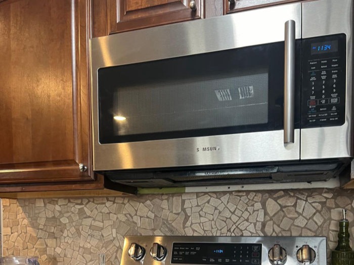 A polished stainless-steel kitchen range